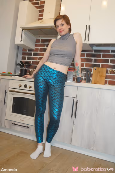 Amanda is in a fun mood as she gets naked in the kitchen for us in VR gallery